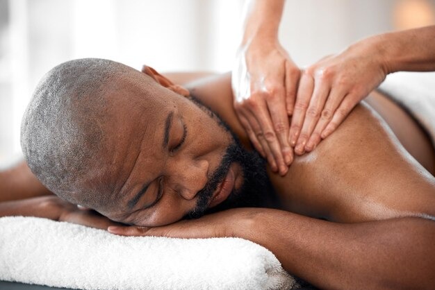 Client relaxing during a back massage session